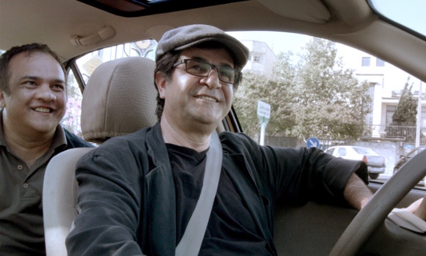 An undated handout picture shows director Jafar Panahi in a still from his film 'Taxi'.