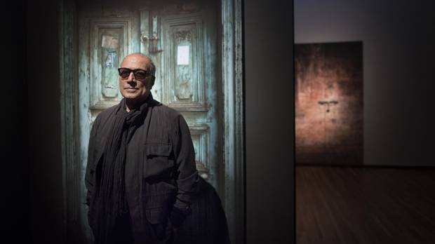 Abbas Kiarostami in front of his photo exhibit.